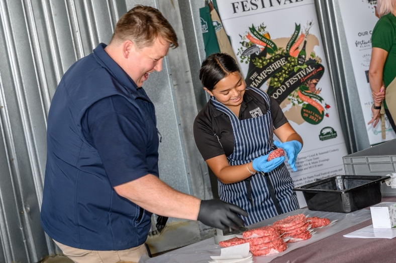Sean Thurgood from Hogget and Boar Butchery persuading students to prepare burgers