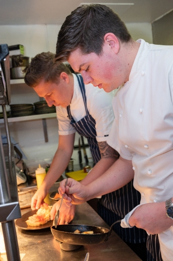 Head Chef Sam Pearson and Sous Chef Lewis Hodder in the kitchen at The White Horse Otterbourne